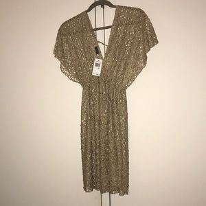 Gold bathing suit cover up. Brand new with tags.